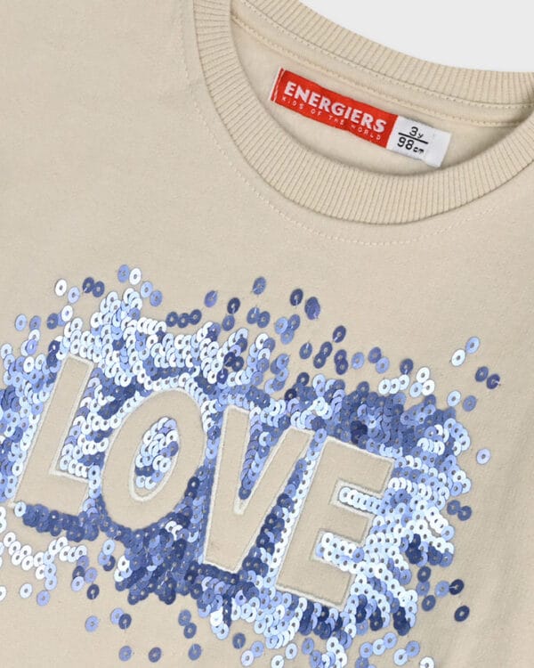 Παιδικό σετ στο χρώμα της βανίλιας με παντελόνι ριπ καμπάνα - Image 3