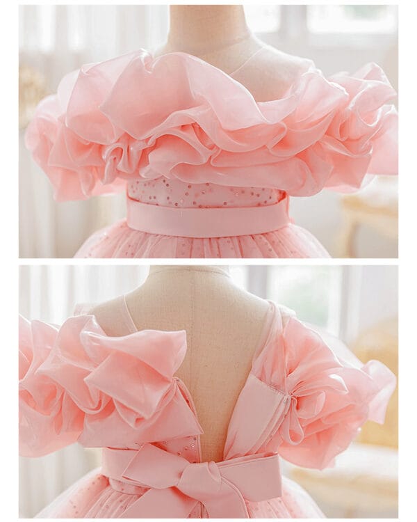 Παιδικό φόρεμα σομόν με ιδιαίτερους ώμους και παγιέτες - Image 2